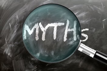 Magnifying glass hovering over “myths