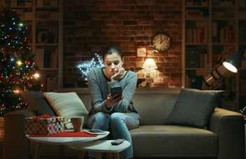 Woman sits sad and alone feeling disconnected during the holiday season