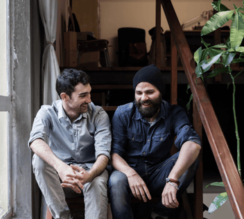 Two men talking, opening up, and sharing about life